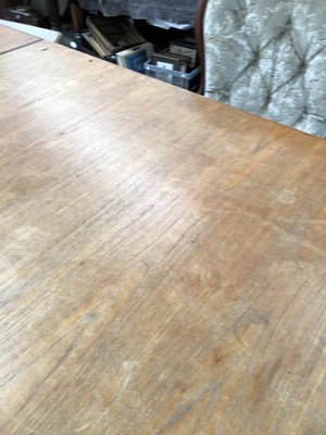 Lot 2744 - A large retro teak dining table.