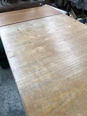 Lot 2744 - A large retro teak dining table.
