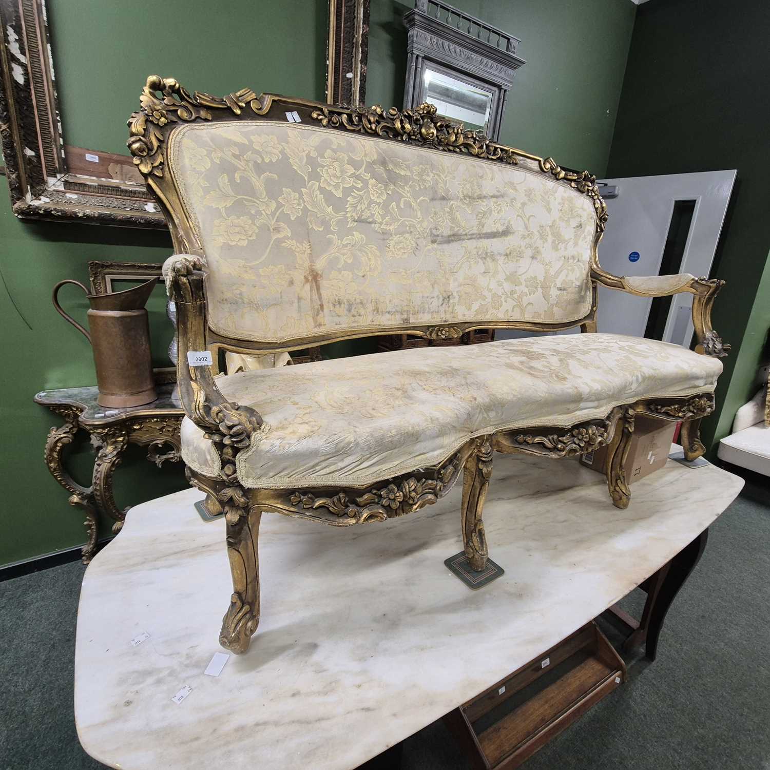 Lot 2802 - A gilt showframe salon settee.
