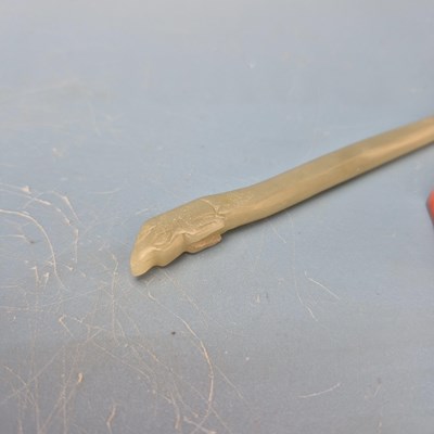 Lot 202 - A Chinese nephrite jade hair pin, the spiral...