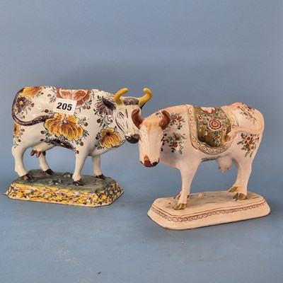 Lot 205 - Two 19th century polychrome Delft cows painted...
