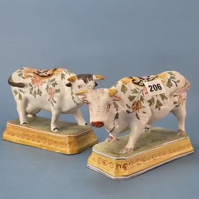 Lot 206 - A pair of 19th century polychrome Delft cows...