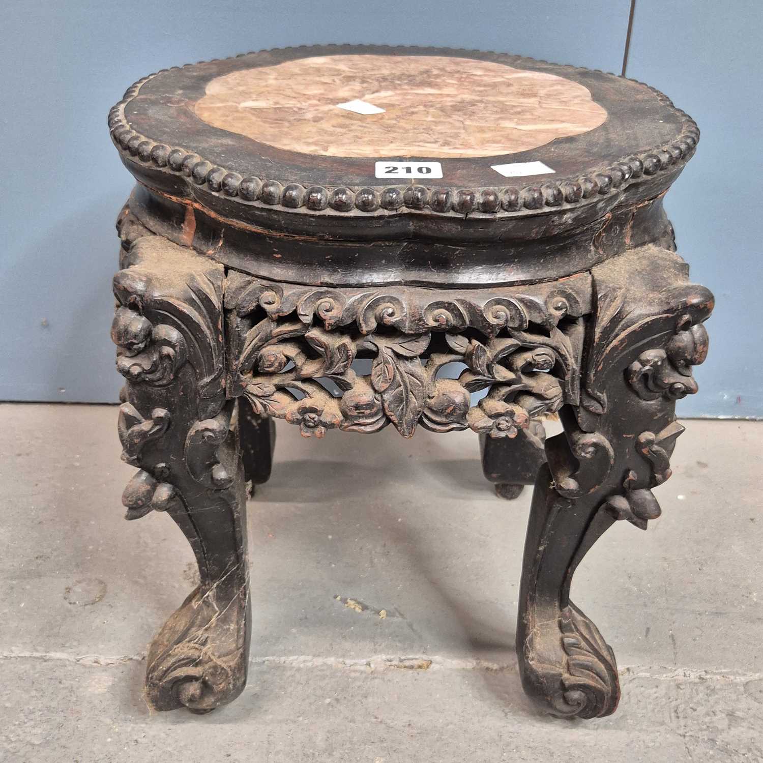 Lot 210 - A Chinese marble topped hardwood stand, the...