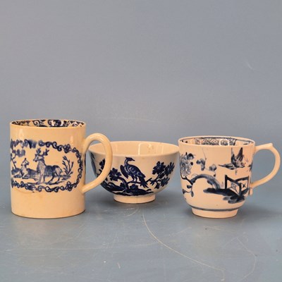 Lot 219 - A Lowestoft blue and white coffee cup painted...