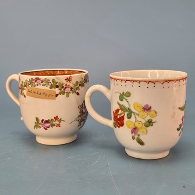 Lot 220 - A Lowestoft coffee cup painted with chains of...