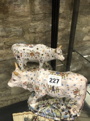 Lot 227 - A pair of 19th century polychrome Delft cows...