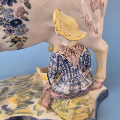 Lot 229 - A 19th century Dutch Delft polychrome cow and...