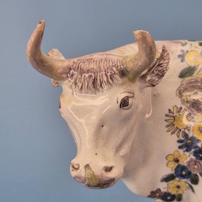 Lot 229 - A 19th century Dutch Delft polychrome cow and...