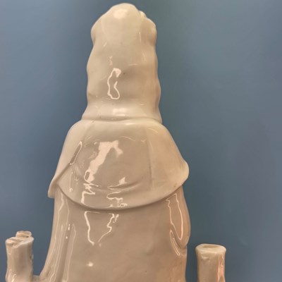 Lot 233 - A blanc de Chine figure of Guanyin seated...