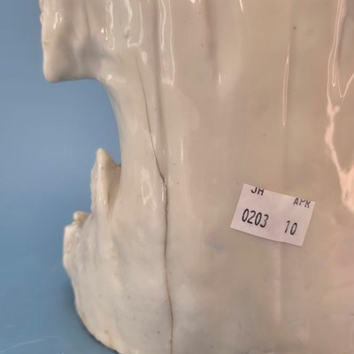 Lot 233 - A blanc de Chine figure of Guanyin seated...