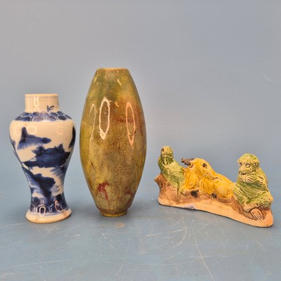 Lot 237 - A Chinese pottery brush rest in the form of a...