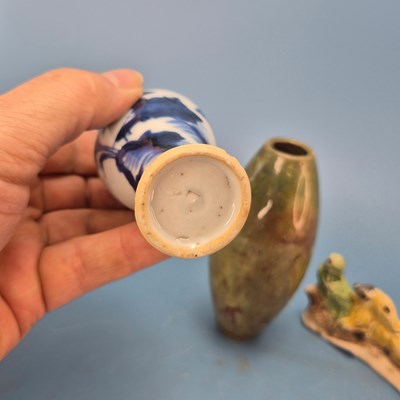 Lot 237 - A Chinese pottery brush rest in the form of a...