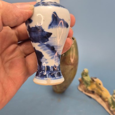 Lot 237 - A Chinese pottery brush rest in the form of a...