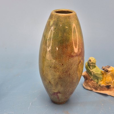 Lot 237 - A Chinese pottery brush rest in the form of a...