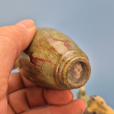 Lot 237 - A Chinese pottery brush rest in the form of a...