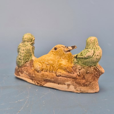 Lot 237 - A Chinese pottery brush rest in the form of a...