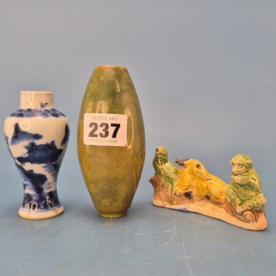 Lot 237 - A Chinese pottery brush rest in the form of a...