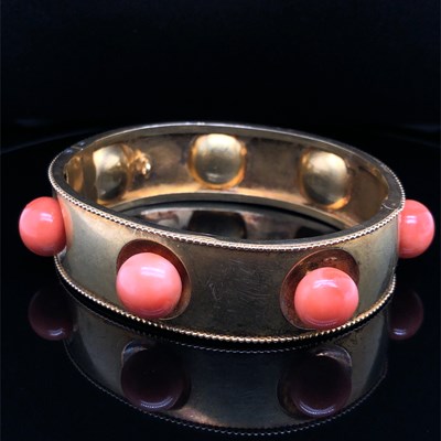 Lot 1 - An antique Etruscan revival coral bangle. The...