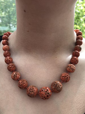 Lot 2 - A vintage graduated necklace of coral beads....
