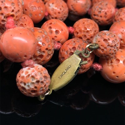 Lot 2 - A vintage graduated necklace of coral beads....
