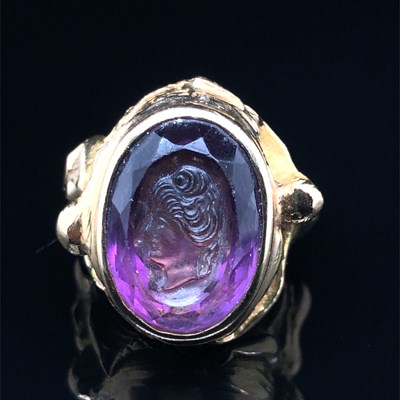 Lot 3 - A purple Facet cut & carved portrait cameo...