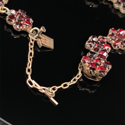 Lot 4 - A vintage garnet cluster panel bracelet. The...