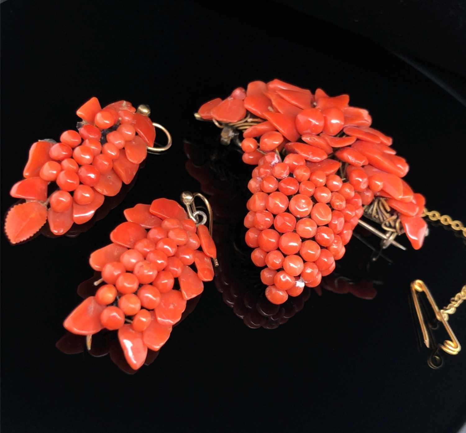 Lot 5 - An antique coral brooch and earring suite in...