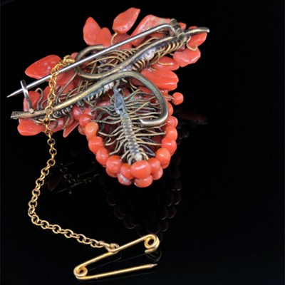 Lot 5 - An antique coral brooch and earring suite in...