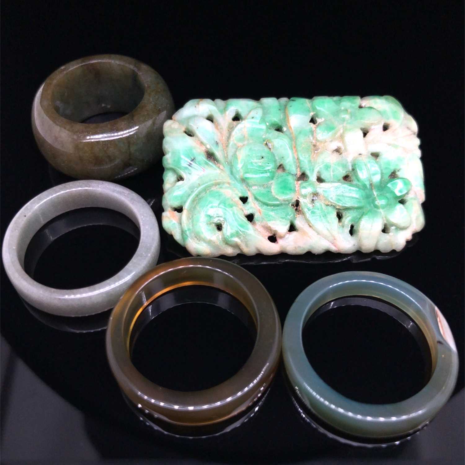 Lot 9 - An antique carved green jade brooch and four...