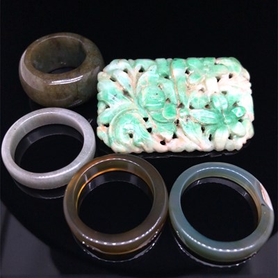 Lot 9 - An antique carved green jade brooch and four...