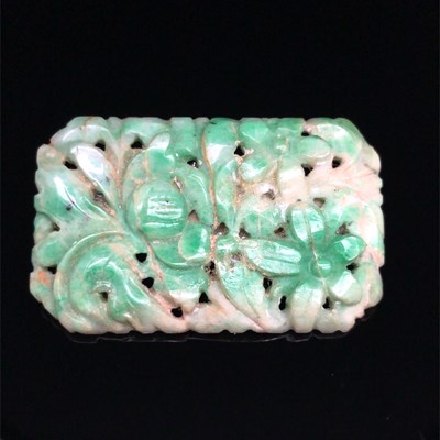Lot 9 - An antique carved green jade brooch and four...