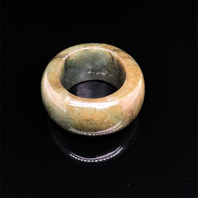 Lot 9 - An antique carved green jade brooch and four...