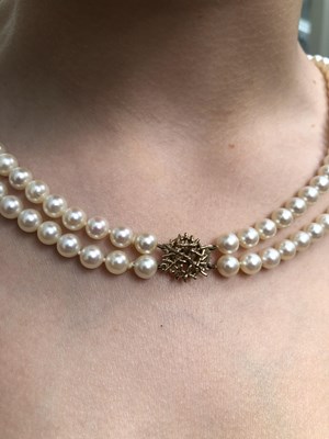Lot 18 - A vintage double-strand uniform cultured pearl...