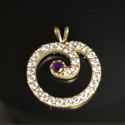 Lot 25 - A gemset and cz contemporary pendant....