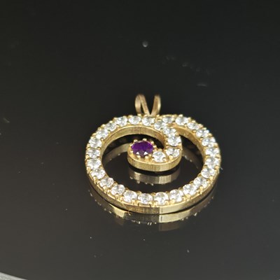 Lot 25 - A gemset and cz contemporary pendant....
