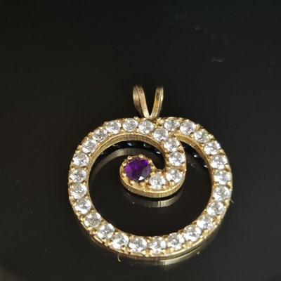Lot 25 - A gemset and cz contemporary pendant....