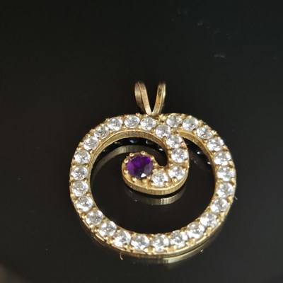 Lot 25 - A gemset and cz contemporary pendant....