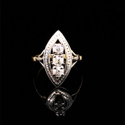 Lot 32 - A diamond marquise shape three stone ring. The...