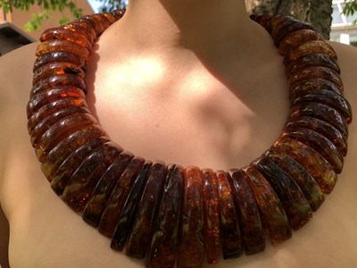 Lot 34 - A large and impressive amber collar necklace,...