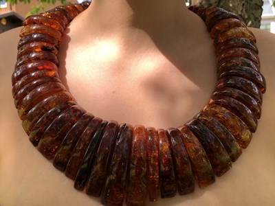 Lot 34 - A large and impressive amber collar necklace,...