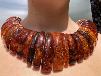 Lot 34 - A large and impressive amber collar necklace,...
