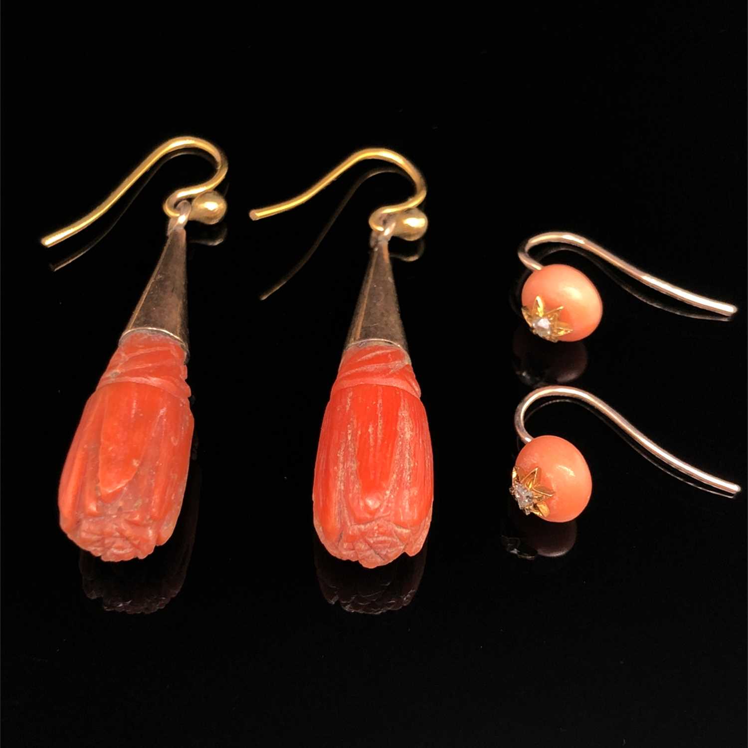 Lot 36 - Two pairs of antique coral earrings. A carved...