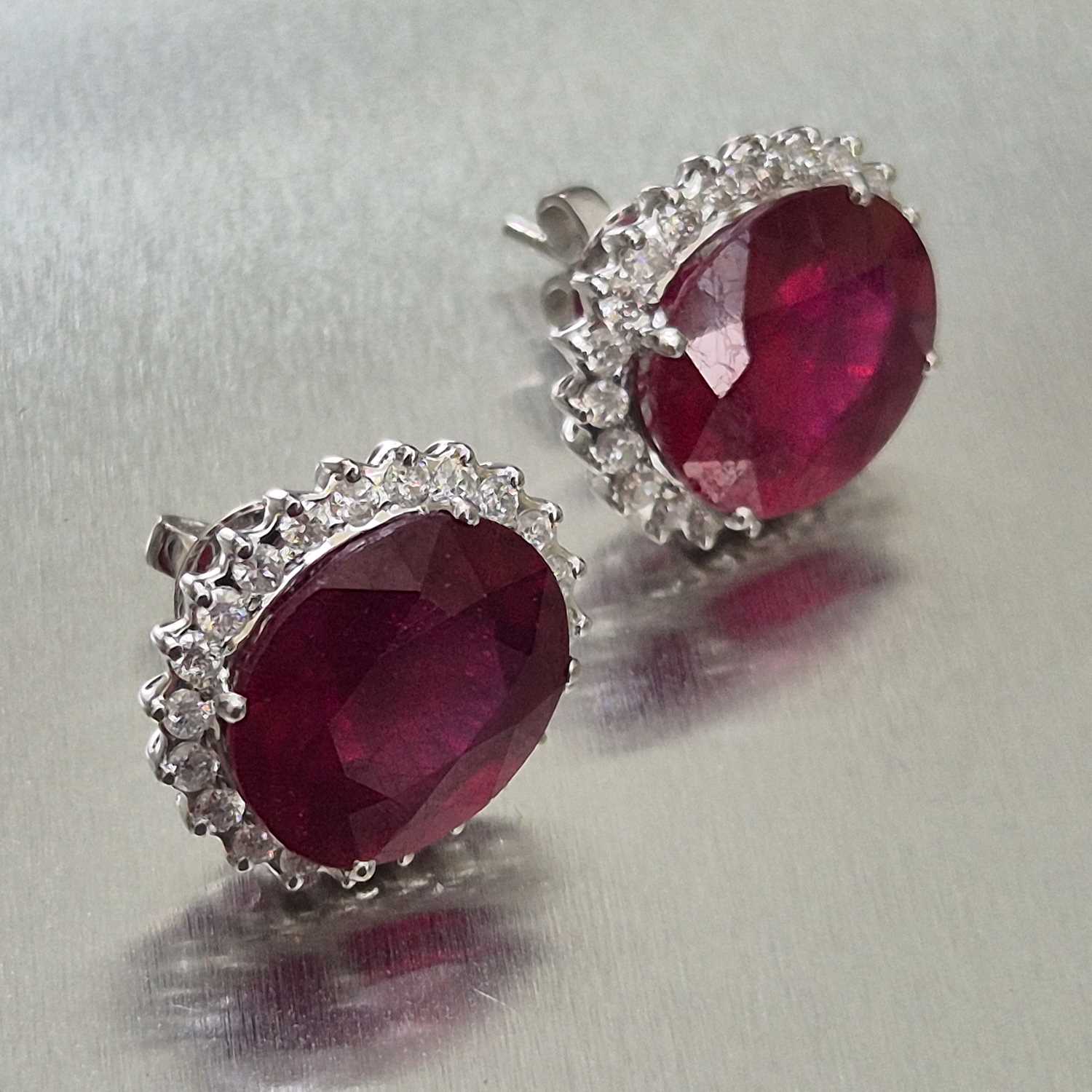 Lot 39 - A pair of large ruby and diamond cluster...