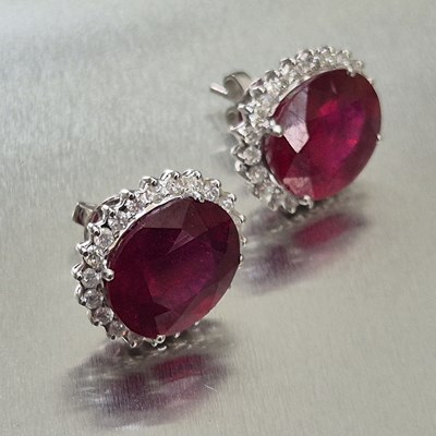 Lot 39 - A pair of large ruby and diamond cluster...