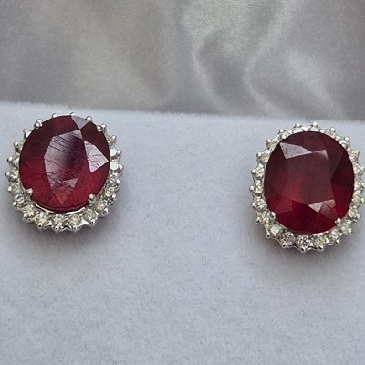 Lot 39 - A pair of large ruby and diamond cluster...