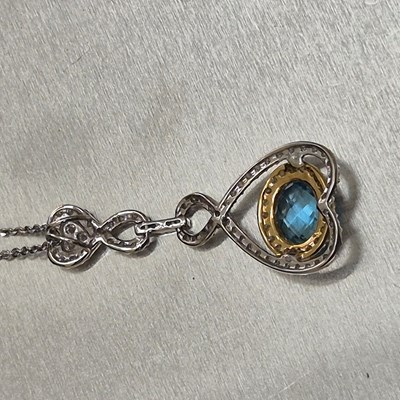 Lot 44 - A blue topaz and diamond articulating drop...