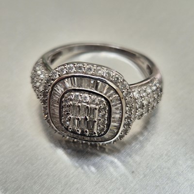 Lot 49 - A 9ct hallmarked white gold and diamond...