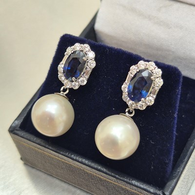 Lot 54 - A pair of sapphire, diamond and pearl cocktail...
