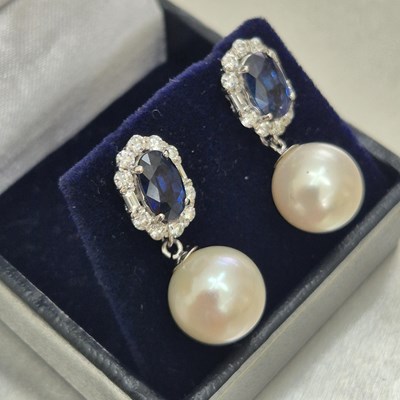 Lot 54 - A pair of sapphire, diamond and pearl cocktail...