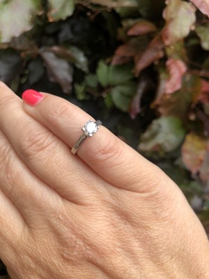 Lot 57 - A diamond and platinum hallmarked solitaire...